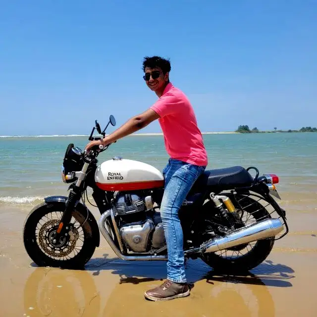 Posing on the beach at Alamparai Fort, on my friend's INT650